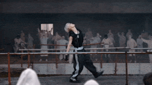a person with their arms outstretched in a dark room