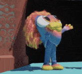 a colorful cartoon character with big eyes stands on a stage