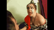 a woman is making a funny face while looking at herself in the mirror