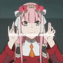 a girl with long pink hair and a flower crown on her head is making a peace sign .
