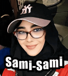 a woman wearing glasses and a ny hat with the name sami-sami