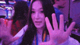 a woman making a funny face with her hands