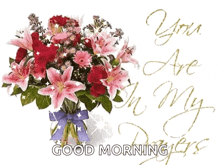 a bouquet of flowers with the words " you are in my prayers " written on it