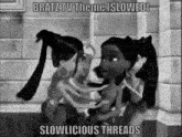 a black and white photo of two bratz dolls talking to each other in a bathroom .