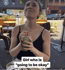 a woman drinking a green smoothie with the words girl who is going to be okay below her