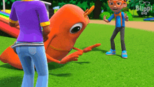 a man in a purple shirt is standing next to a cartoon character that says blippi