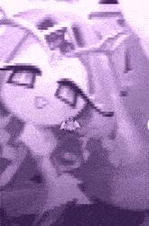 a blurry picture of a person 's face with a purple background and a small angel on it .