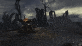 a dark landscape with a few trees and buildings in the background