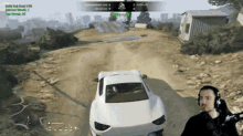 a man is playing a video game while a car is driving by