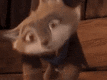 a close up of a cartoon fox with a surprised look on his face .