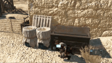 a man in a video game is standing next to a box that says " e " on it