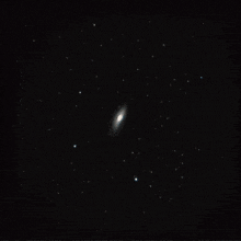 a computer generated image of a galaxy with red spots on it