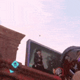 a person is playing a video game and a bullet is going through the screen .
