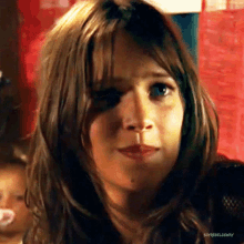a close up of a woman 's face with soyrebeldeway written on the bottom right