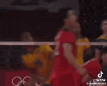 a group of volleyball players are playing a game of volleyball .