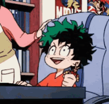 a cartoon character is sitting in a chair with a woman putting a bracelet on his head .