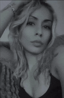 a black and white photo of a woman 's face