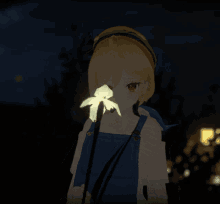 a girl in overalls is holding a flower in her hand
