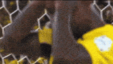 a man in a yellow shirt with the number 1 on the back