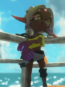 a cartoon character wearing a yellow top and purple shorts stands next to a wooden fence