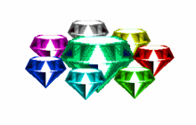 a bunch of colorful gems are stacked on top of each other