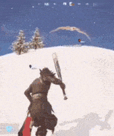 a man is holding a baseball bat in the snow while playing a video game .