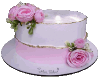 a white cake with pink roses on top and the name max sabor on the side