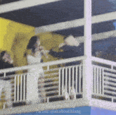 a blurry photo of people standing on a balcony with the hashtag allaboutklang