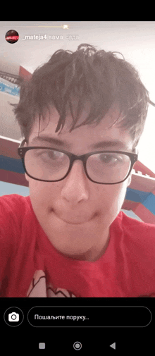 a young boy wearing glasses and a red shirt is smiling