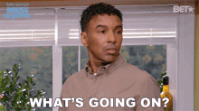 a man in a brown shirt is asking what 's going on