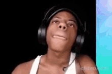 a man wearing headphones is making a funny face .