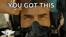 a close up of a man wearing a helmet with the words " you got this " on it