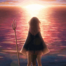 a girl with a trident stands in front of a body of water