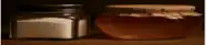 a jar of honey and a jar of salt are on a table