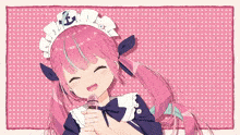 a girl with pink hair is wearing a maid outfit and singing into a microphone