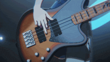 a close up of a person playing a bass guitar with a blue background
