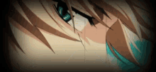 a close up of a person 's face with a tear coming out of it