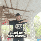 a man wearing a helmet and a t-shirt that says ca nha nhay cũng minh nhee
