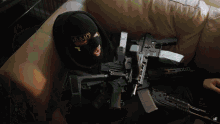 a person wearing a mask and holding a gun with the word amo on the front