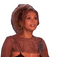 a woman with curly hair is smiling and says ooh nice