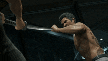 a man without a shirt is holding a sword in his hands