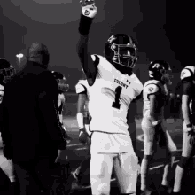 a football player wearing a jersey that says colony