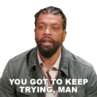 a man with a beard and a jacket says you got to keep trying man