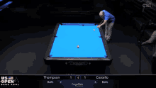 a pool table with a blue cloth and a diamond logo