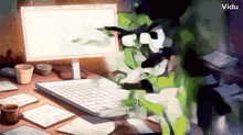 a computer monitor is sitting on a desk next to a laptop computer .