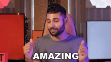 a man with a beard is giving a thumbs up and the word amazing is above him