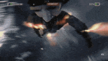 a tv screen shows a man swimming in the water and says fx on the bottom right