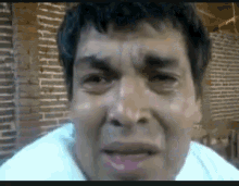 a man is crying with tears running down his face