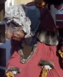 a close up of a person wearing a costume with a hood on their head .