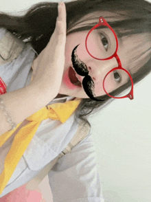 a girl with glasses and a fake mustache